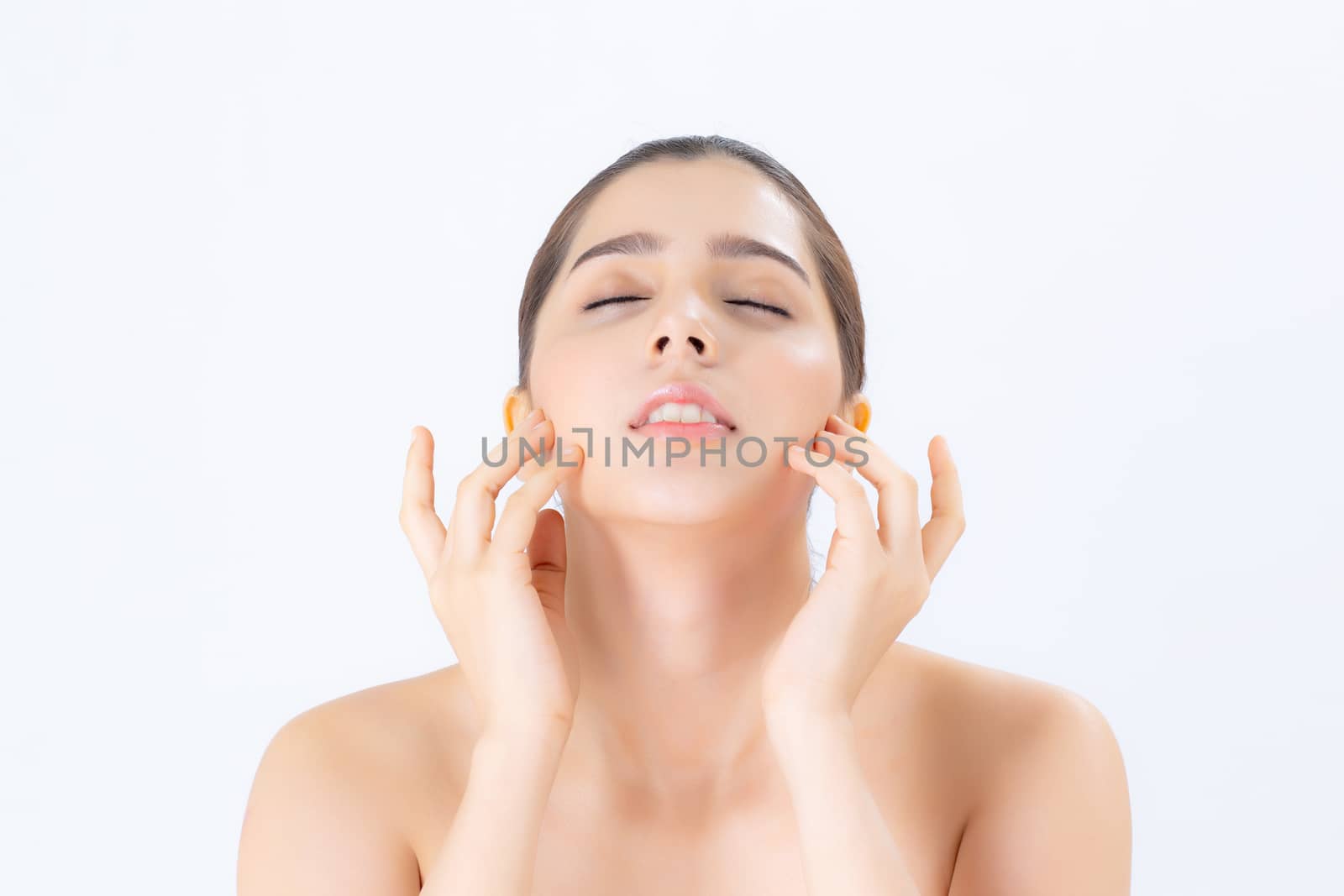 Portrait of beautiful woman makeup of cosmetic, girl hand touch cheek and smile attractive, face of beauty perfect with wellness isolated on white background with skin healthcare concept.