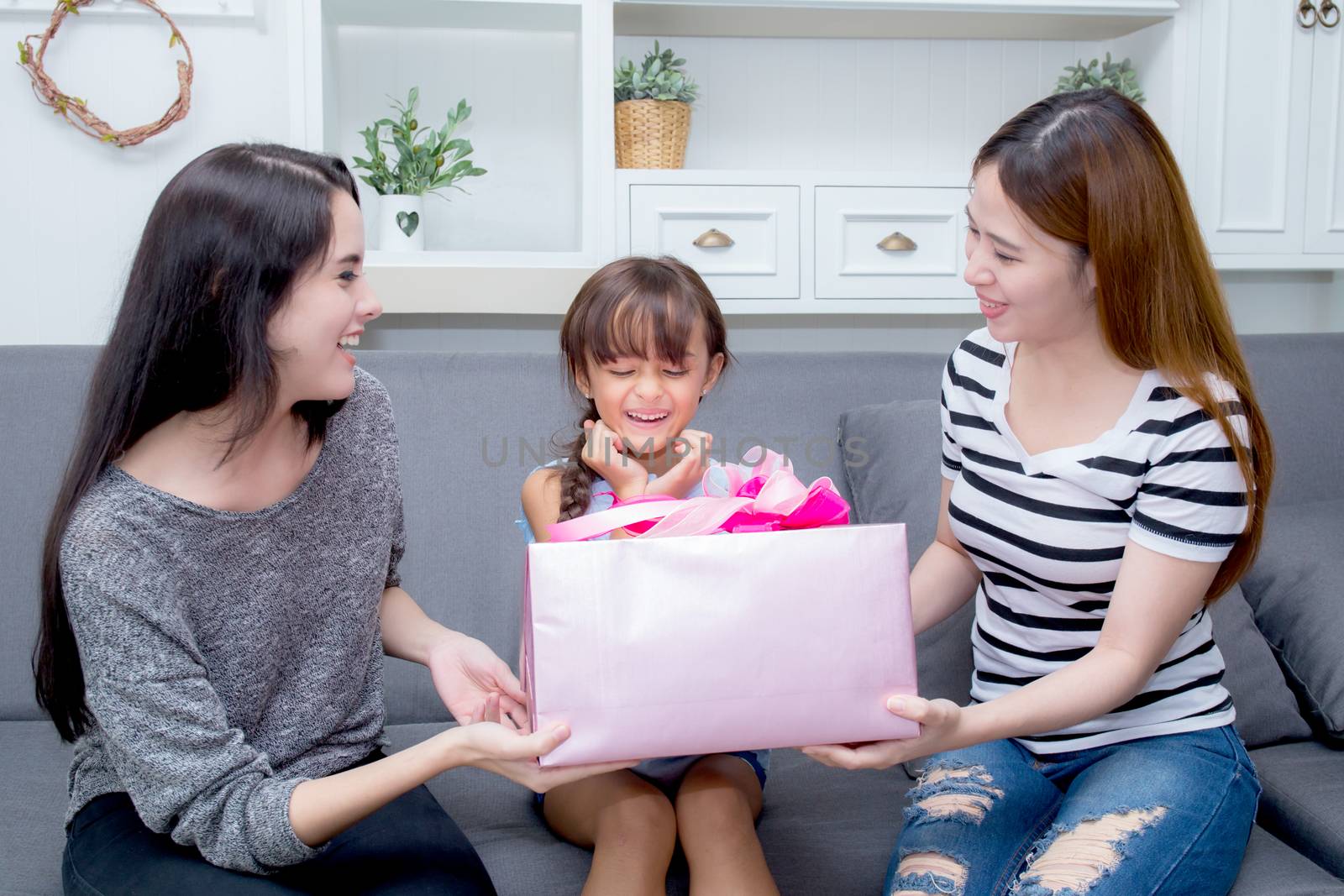 happy of mother and daughter woman asian and aunt with gift with by nnudoo
