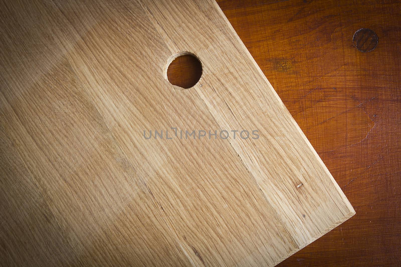 Wooden cutting board on wooden kitchen table