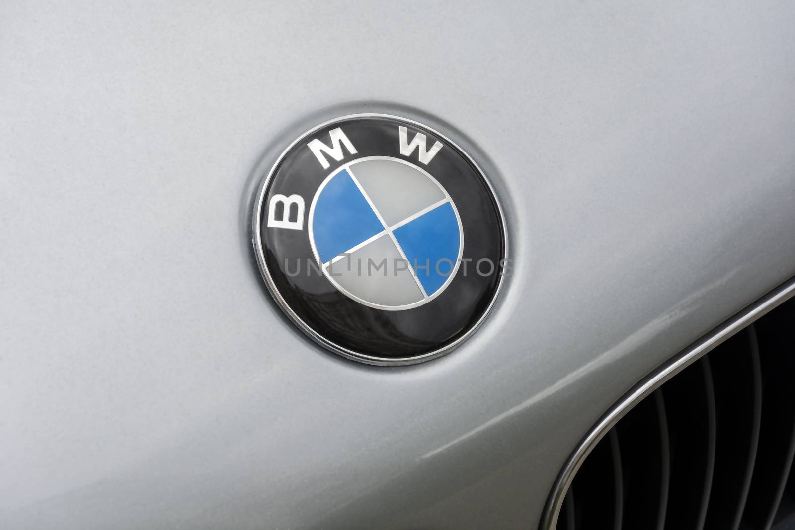 the logo of the German automotive company BMW on the bonnet of t by Grommik
