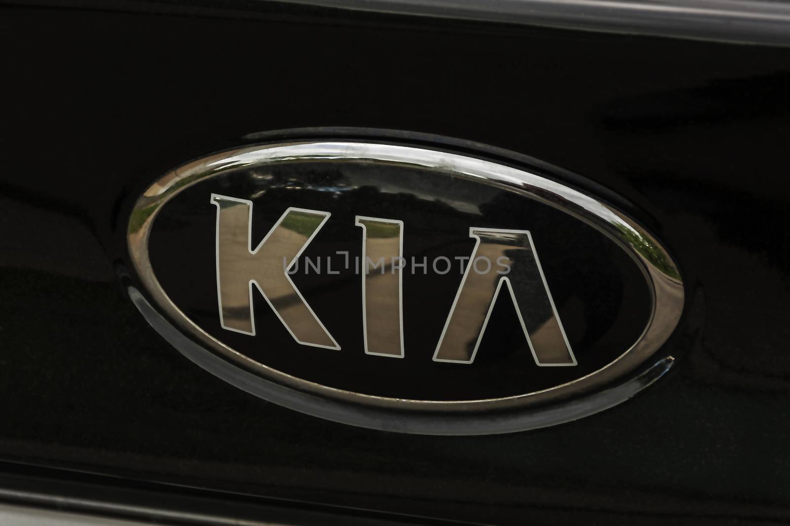 The logo of the Korean automotive company KIA on the boot lid by Grommik