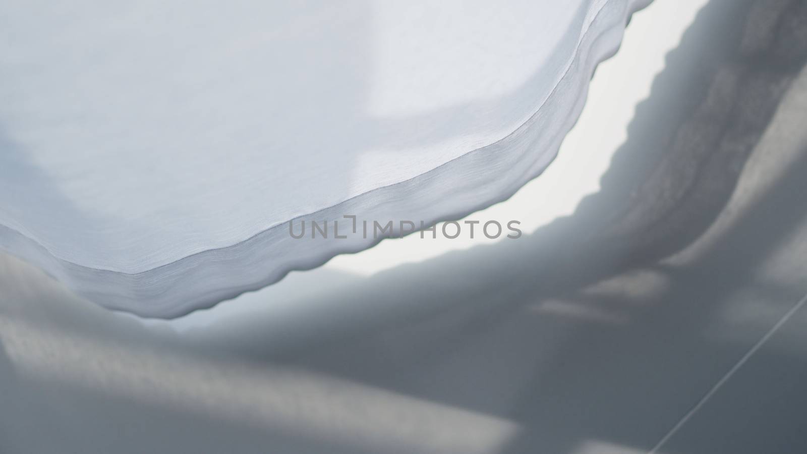 White curtain blowed by wind close-up. by gnepphoto