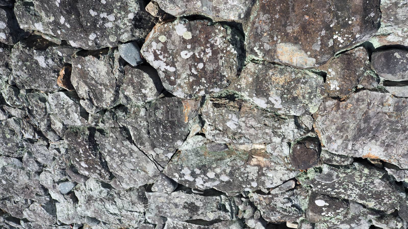 Texture of big real rock stone wall. by gnepphoto