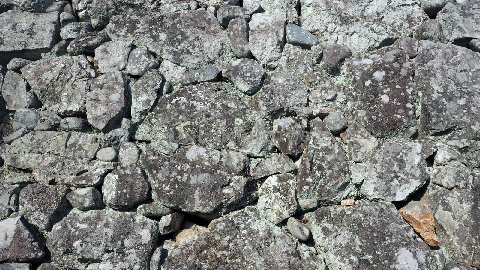 Texture of big real rock stone wall. by gnepphoto