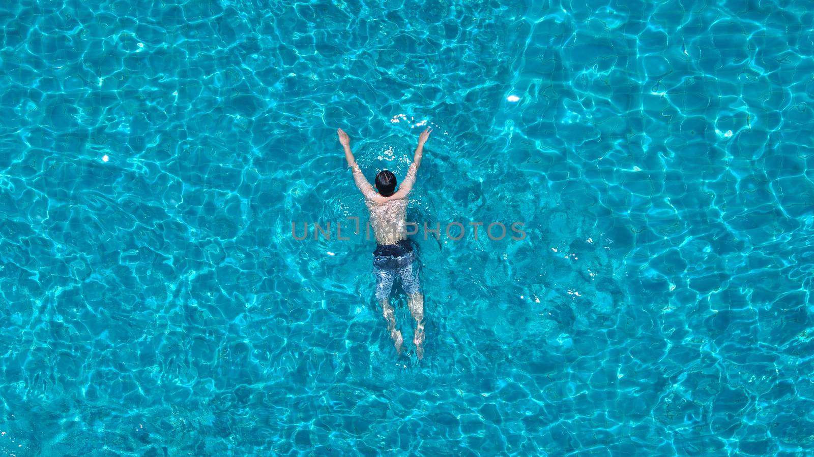 Swimming pool blue color water top view angle. by gnepphoto