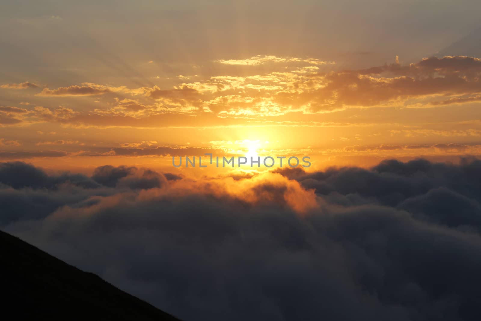 Mountain cloudscape and landscape at sunset in Georgia. Horizon in mountain range.cloudy vivid sunlight, fire storm cloudy view.