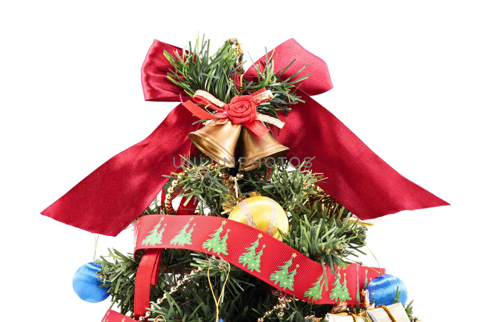 Close up of shot of the top of a decorated Christmas tree, isolated on white background. Christmas, winter, new year concept.