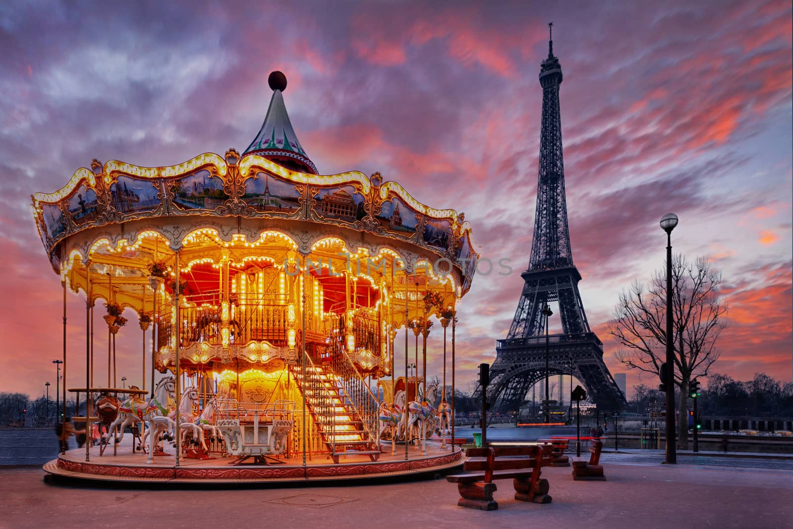 illuminated vintage carousel close to Eiffel Tower, Paris