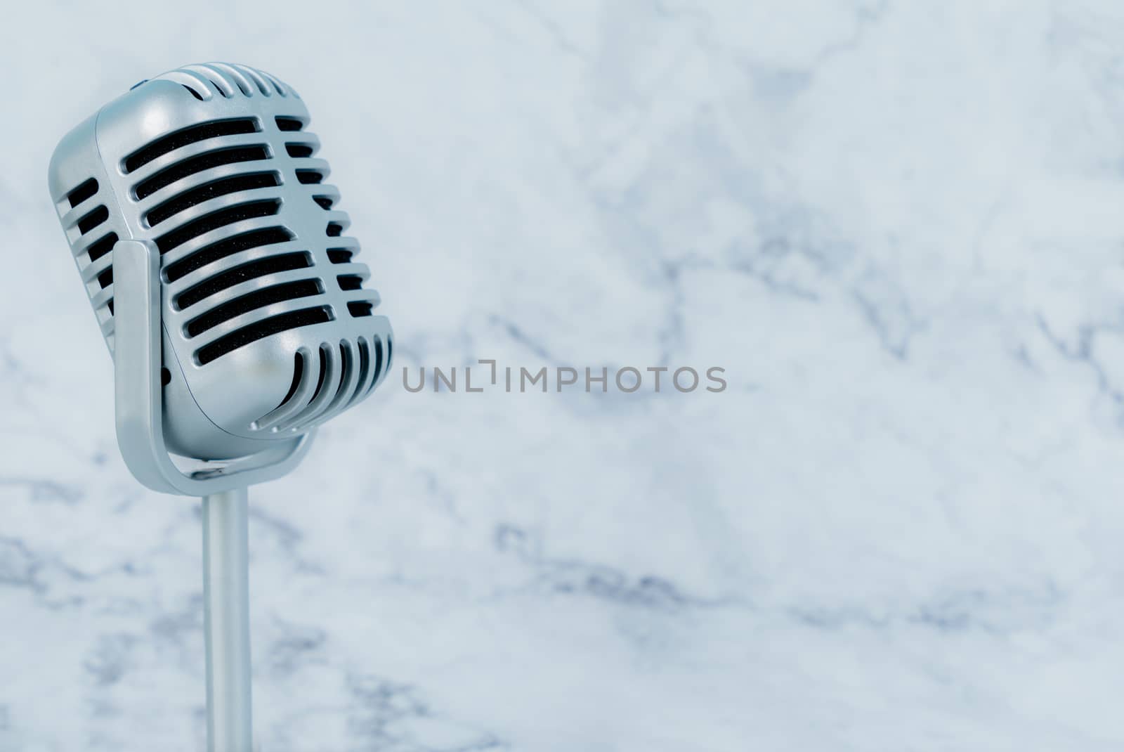 Retro microphone on luxury background