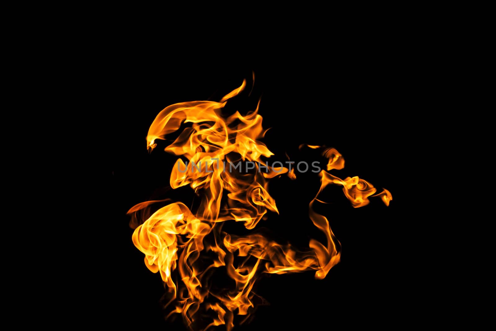 Fire flames on black background isolated. Burning gas or gasoline burns with fire and flames. Flaming burning sparks close-up, fire patterns. Infernal glow of fire in the dark with copy-space