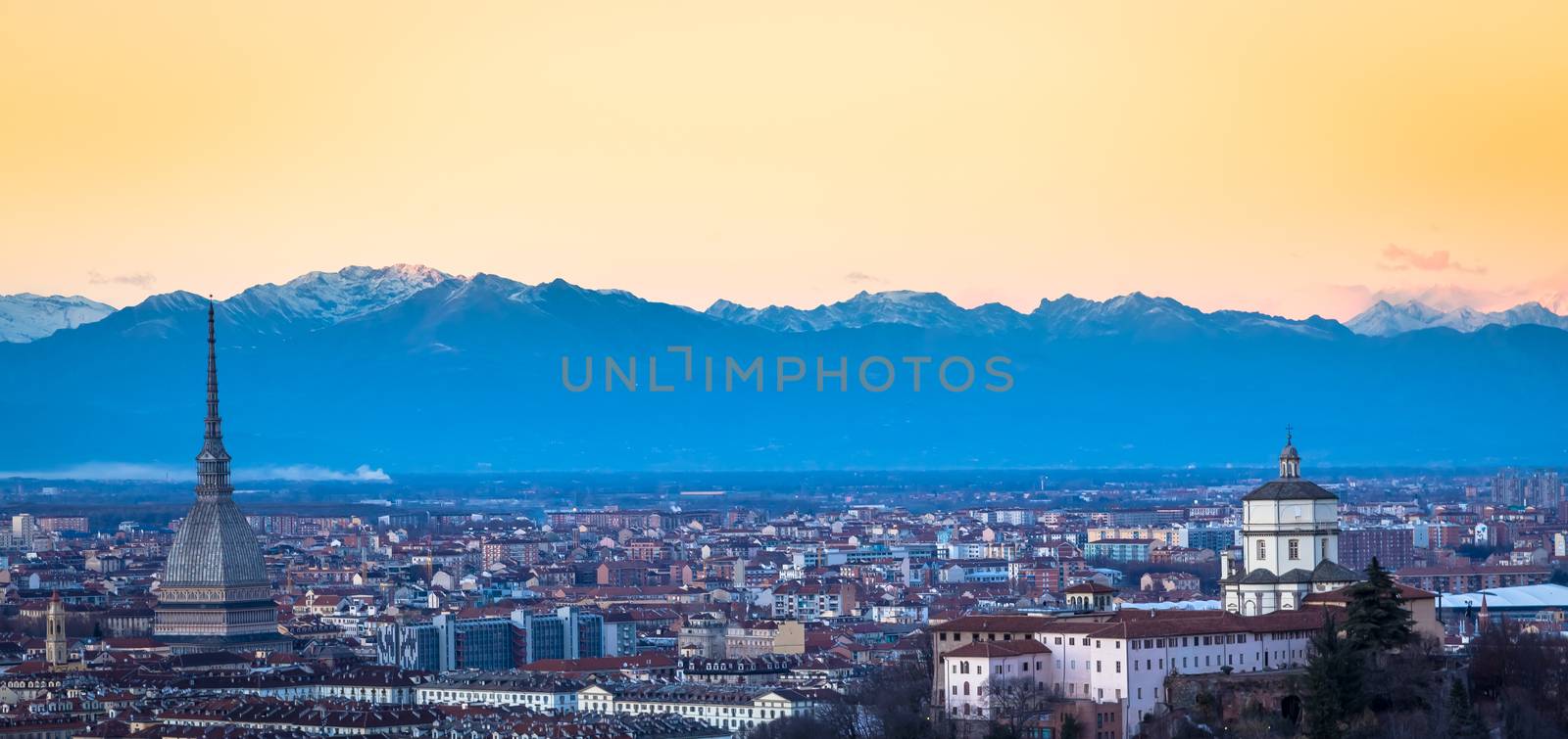 Turin panoramic skyline at sunset with Alps in background by Perseomedusa