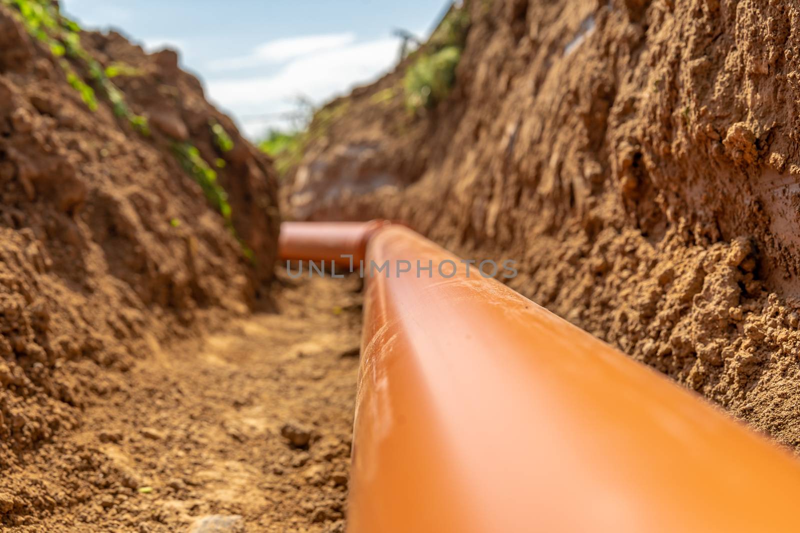 Plastic pipes in the ground during the construction of a building