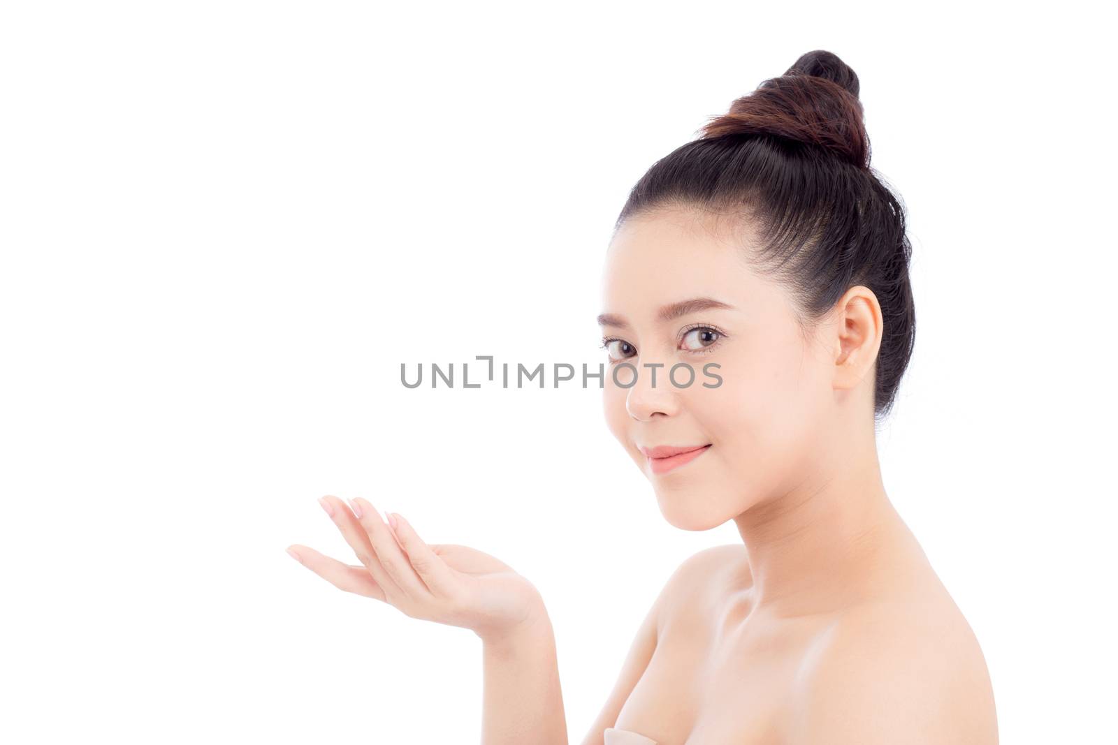 Asian of portrait beautiful young woman showing with healthy clean skin presenting something empty copy space on the hand isolated on white background, beauty concept.