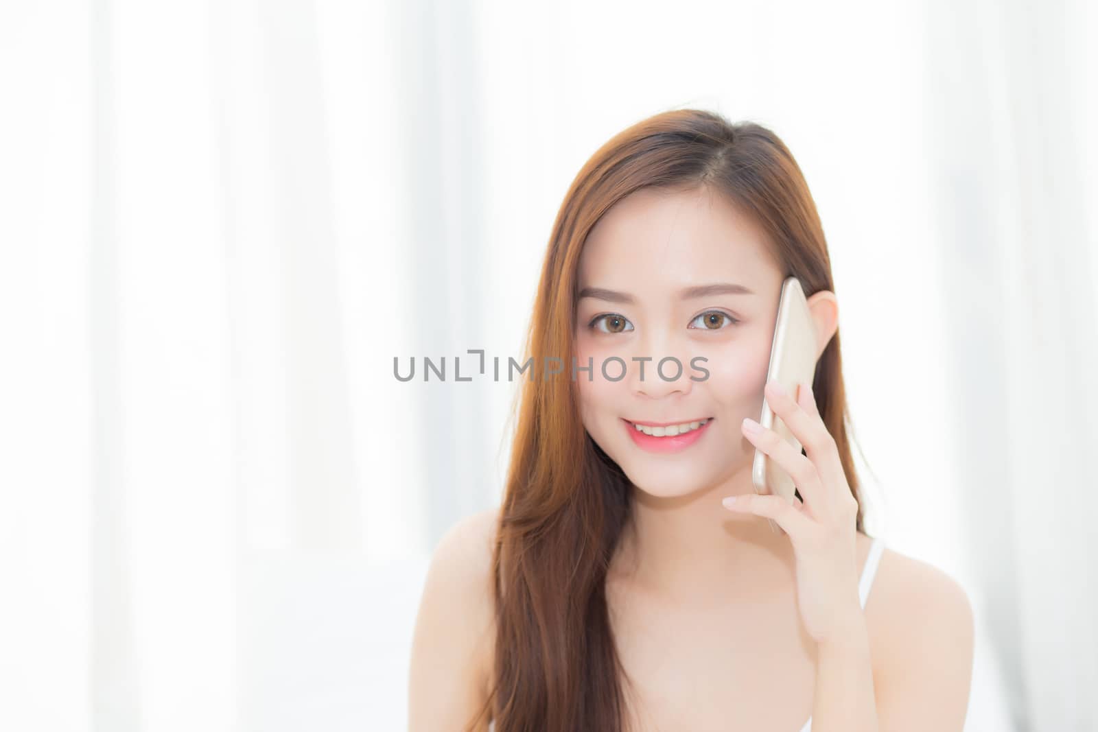 Beautiful of portrait young asian woman smiling sitting relax in by nnudoo