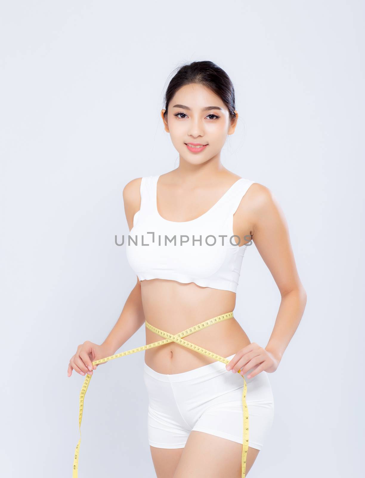beautiful portrait asian woman diet and slim with measuring waist for weight isolated on white background, girl have cellulite and calories loss with tape measure, health and wellness concept.