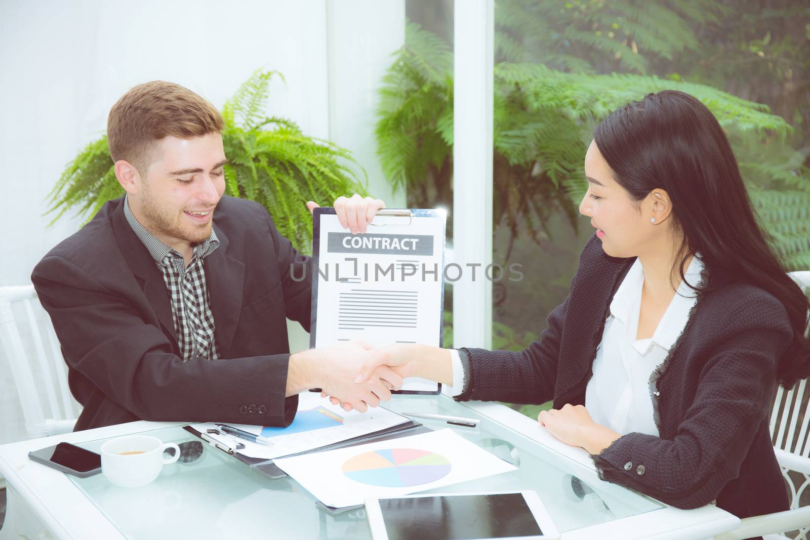 Team businesspeople handshake man and woman with agreement meeting for celebration at office, business marketing success with teamwork and partnership concept.