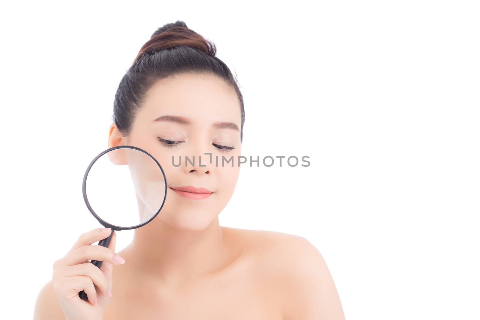 Portrait of beautiful asian woman with clean fresh face, girl magnifying skincare cheek and smile attractive, face of beauty perfect with wellness isolated on white background with skin healthcare concept.