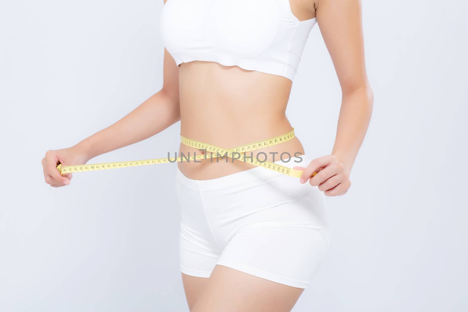 Asian woman diet and slim with measuring waist for weight isolated on white background, girl have cellulite and calories loss with tape measure, health and wellness concept.
