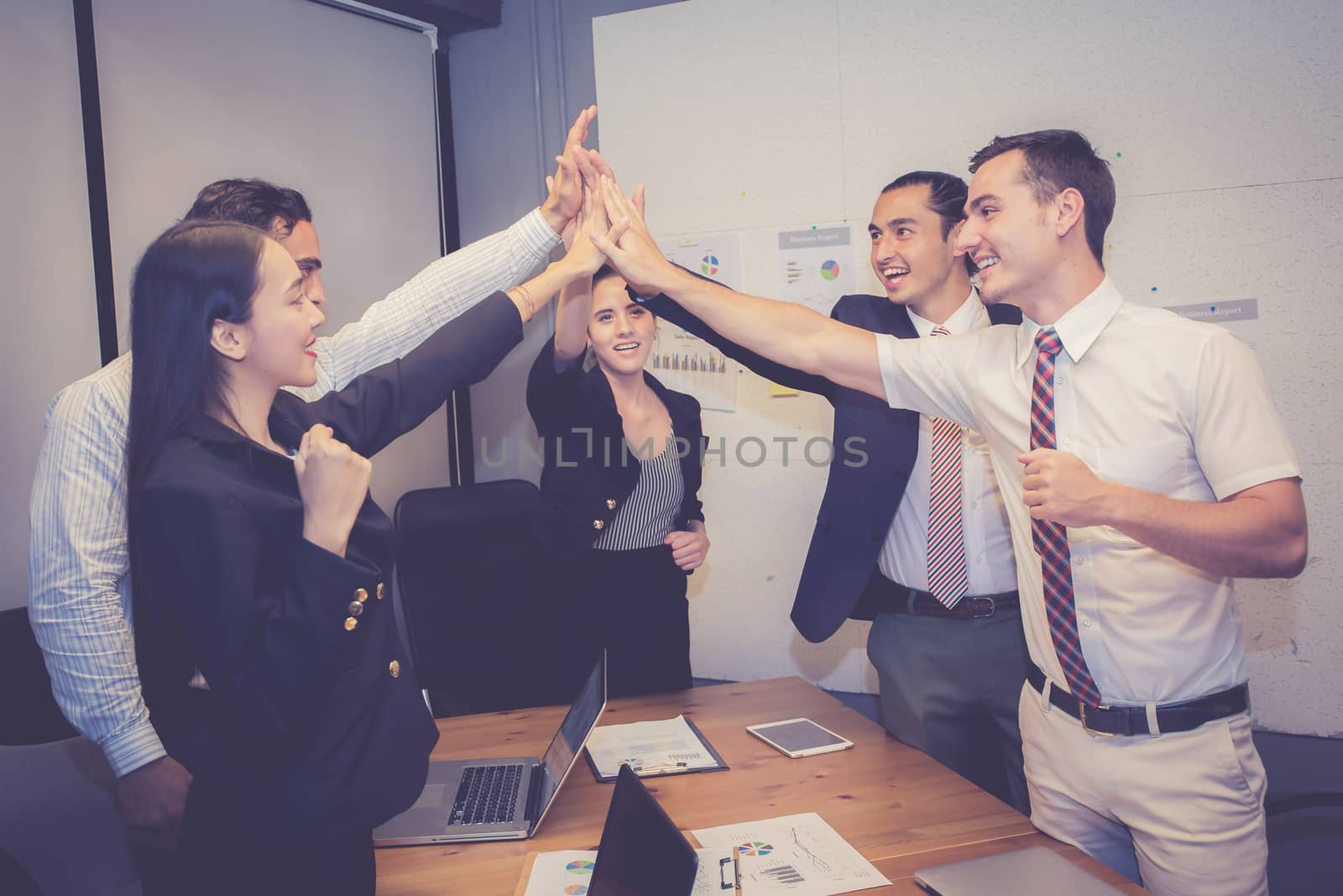 Group business asian people team with success gesture giving hi five in the meeting, agreement with achievement work of teamwork together.