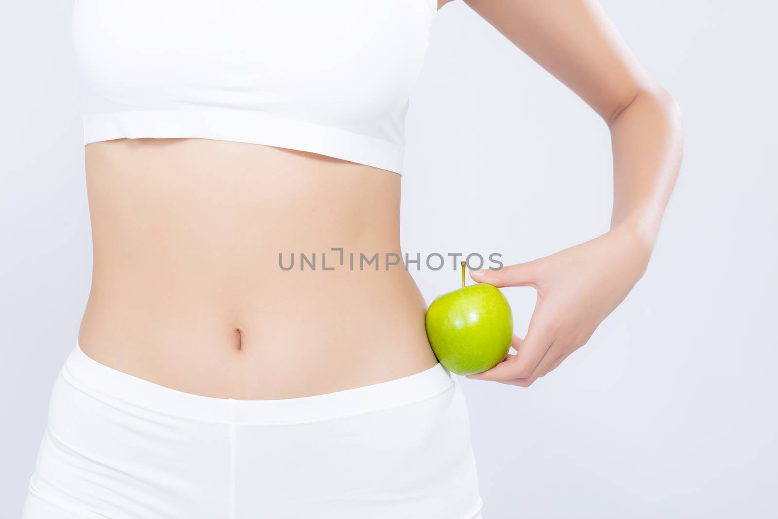 Beautiful body woman sexy slim holding green apple with cellulite for wellness, girl with fitness for weight loss and healthy isolated on white background, healthcare and diet concept.