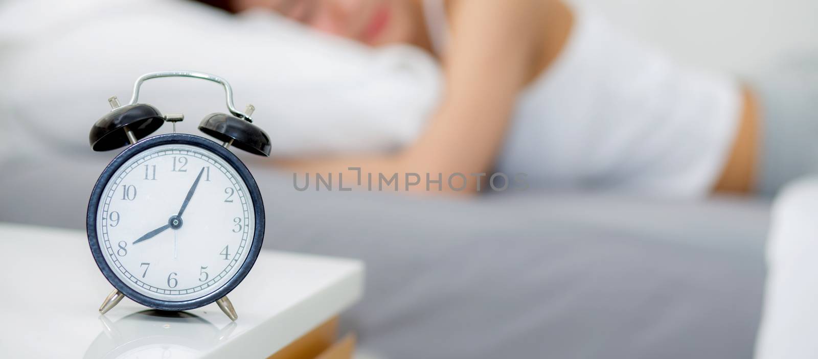 closeup banner website alarm clock and beautiful asian young wom by nnudoo