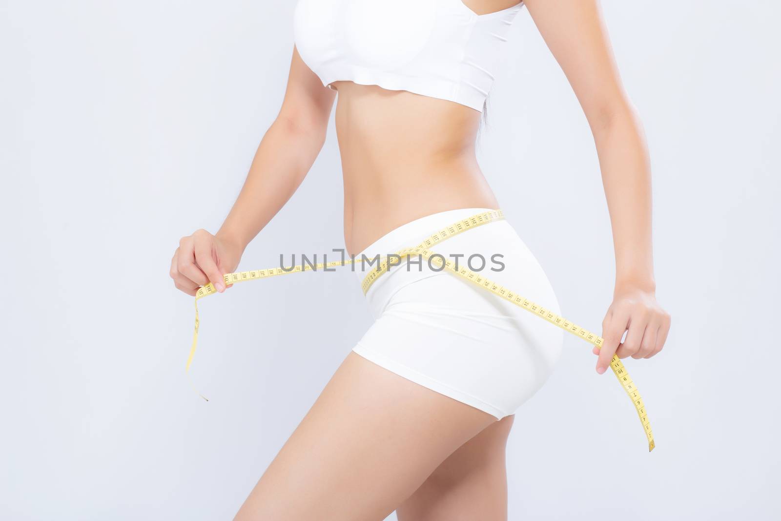 Asian woman diet and slim with measuring waist for weight isolated on white background, girl have cellulite and calories loss with tape measure, health and wellness concept.