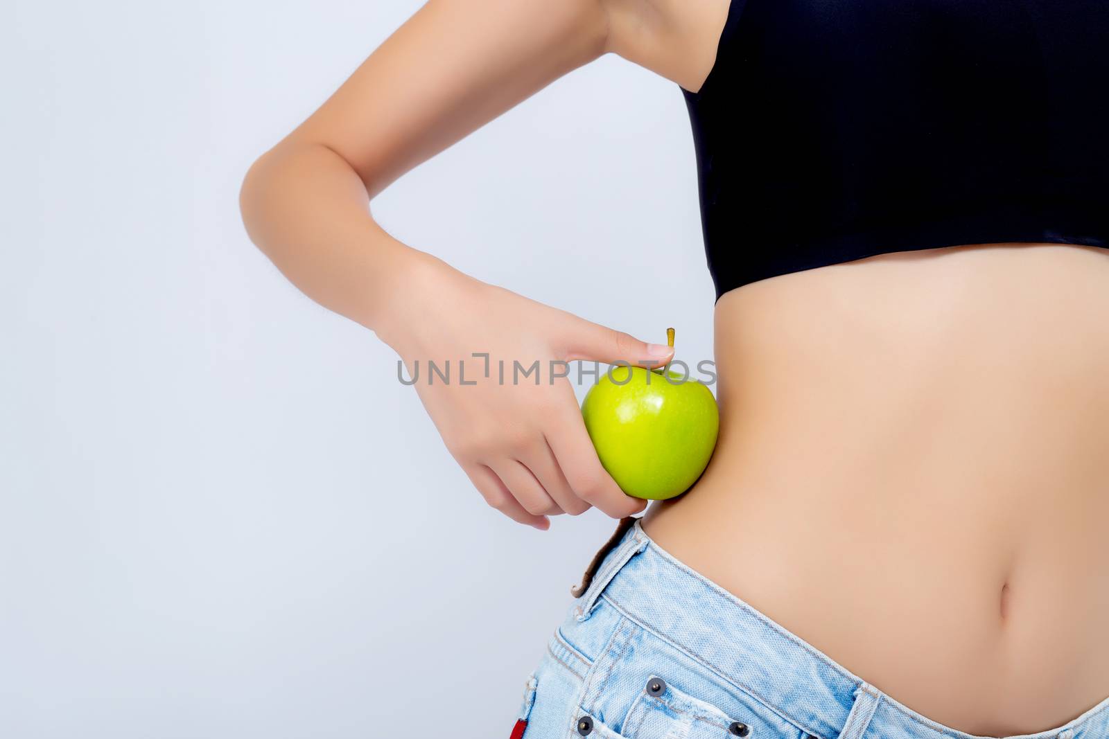 Beautiful body woman sexy slim holding green apple with cellulite for wellness, girl with fitness for weight loss and healthy isolated on white background, healthcare and diet concept.