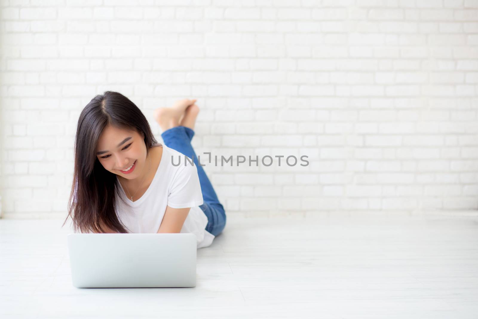 Beautiful of portrait asian young woman working online laptop ly by nnudoo