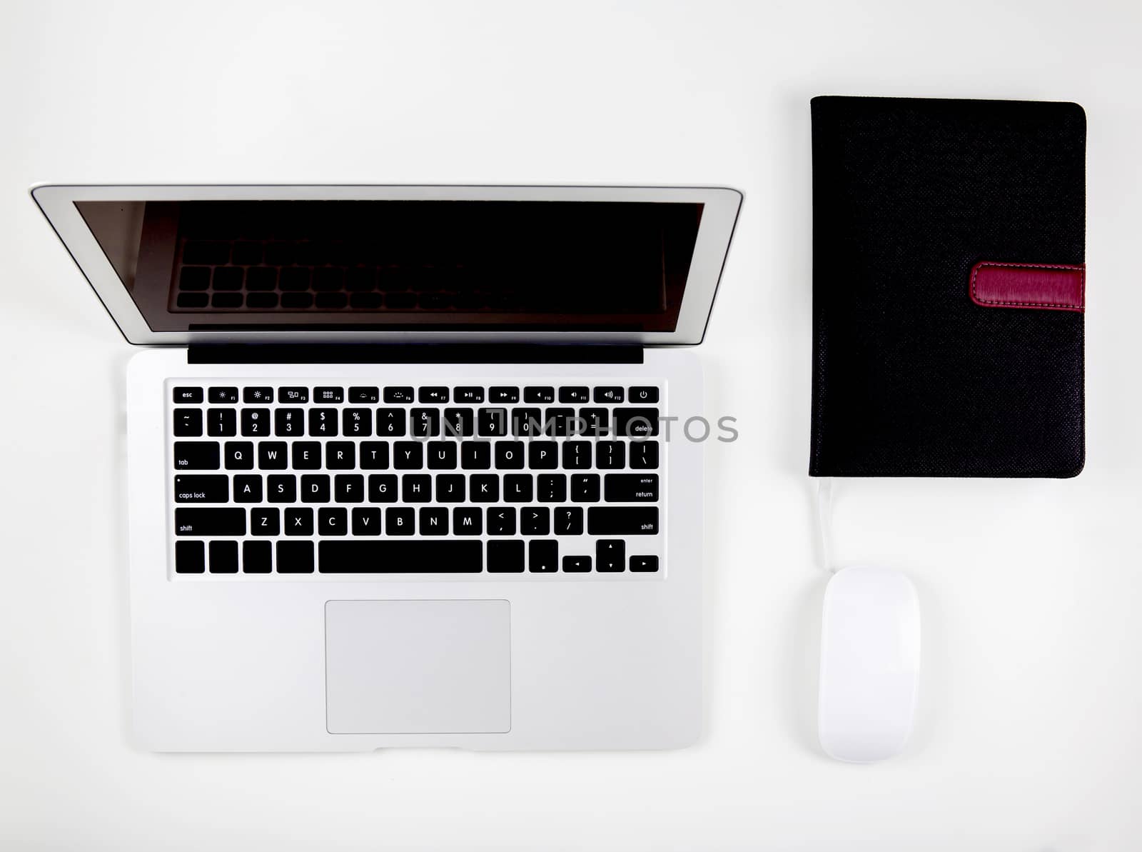 Top view of laptop computer with open display screen monitor, mouse and book isolated on white background, notebook or netbook with keyboard, communication technology concept.