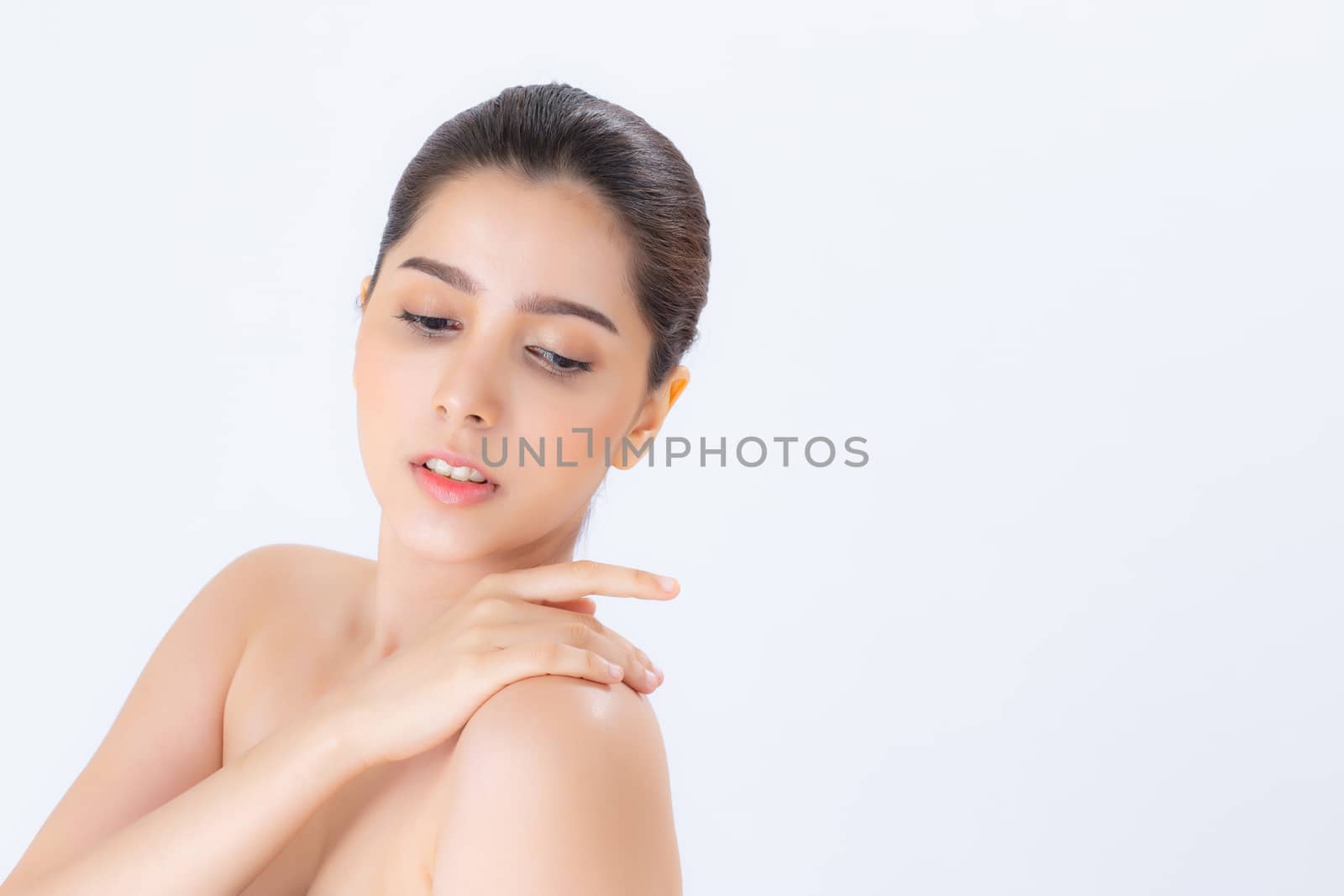 Portrait of beautiful asian woman makeup of cosmetic, girl touch  shoulder and smile attractive, face of beauty perfect with wellness isolated on white background with skin healthcare concept.