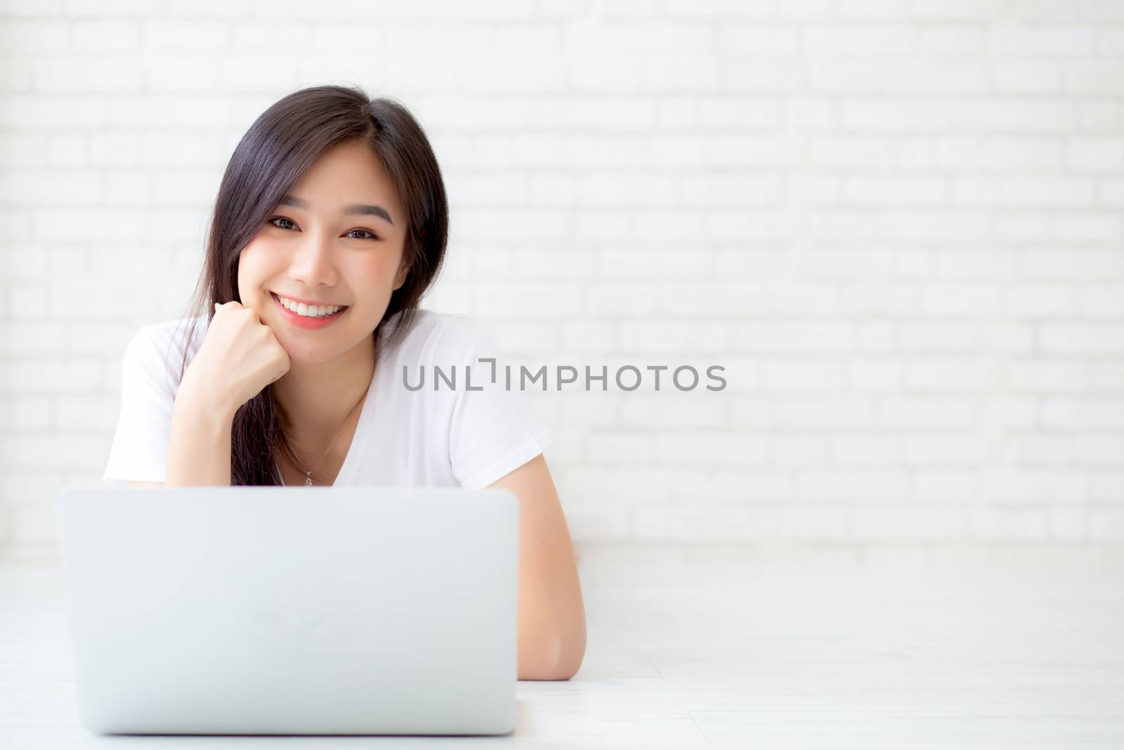 Beautiful of portrait asian young woman working online laptop ly by nnudoo