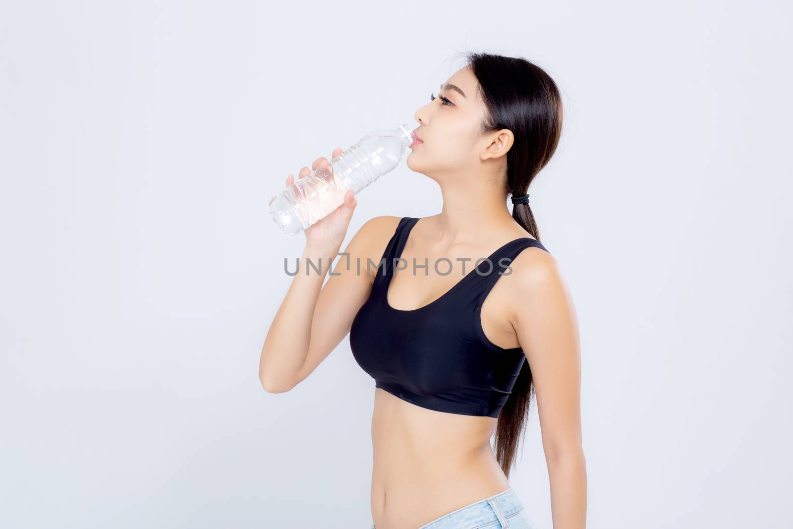 Beautiful portrait asian young woman bottle of water for healthy isolated on white background, girl with fit thirsty after exercise and fitness, health concept.