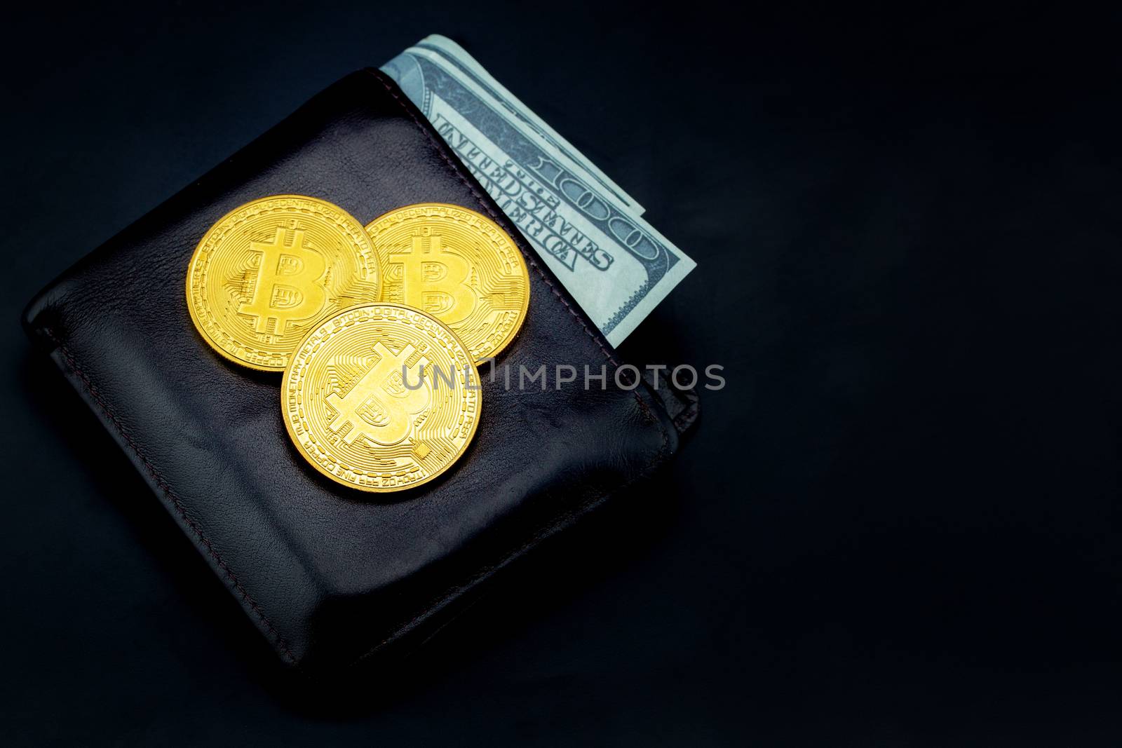Gold bitcoin with leather wallet us dollar isolated on black background, coin money currency virtual digital exchange cash with crypto, technology finance trade, commercial business concept.
