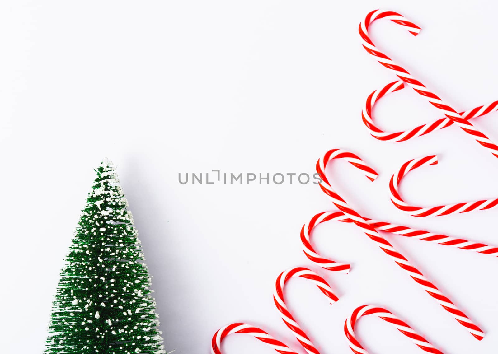 Happy New Year and Christmas day, top view flat lay composition decoration have branch tree and candy on white background with copy space for your text