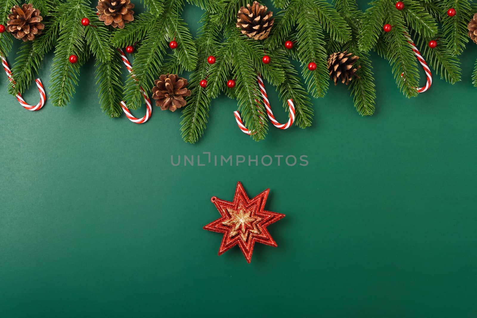 Happy new year, christmas day concept top view flat lay fir tree branches and decoration on Olive Green background with copy space for your text