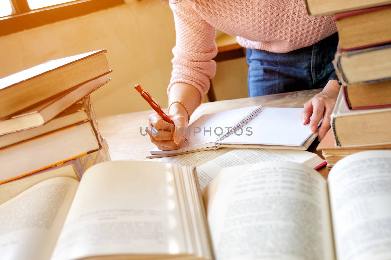 Young woman studying in library