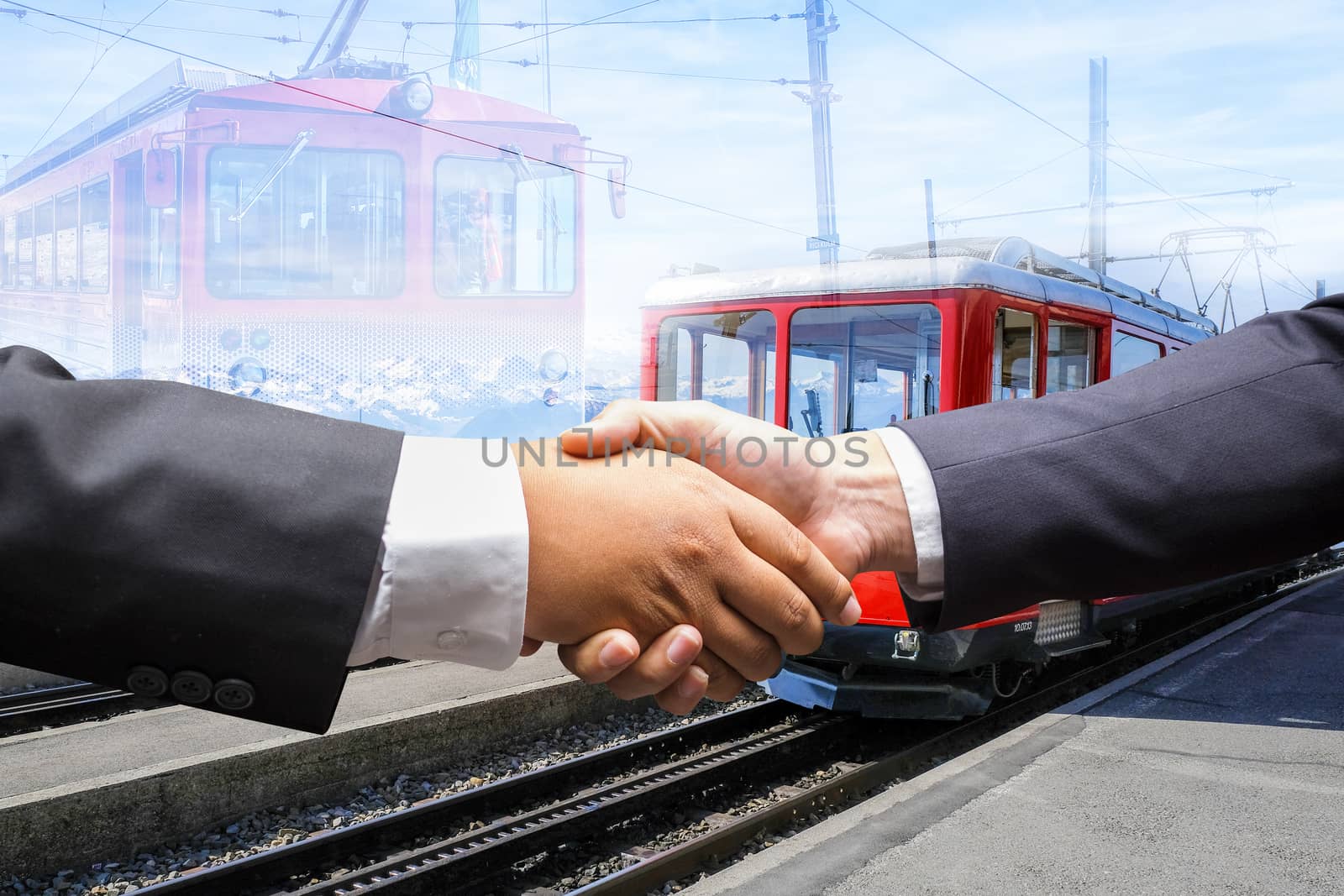 Business men shaking hands by Surasak