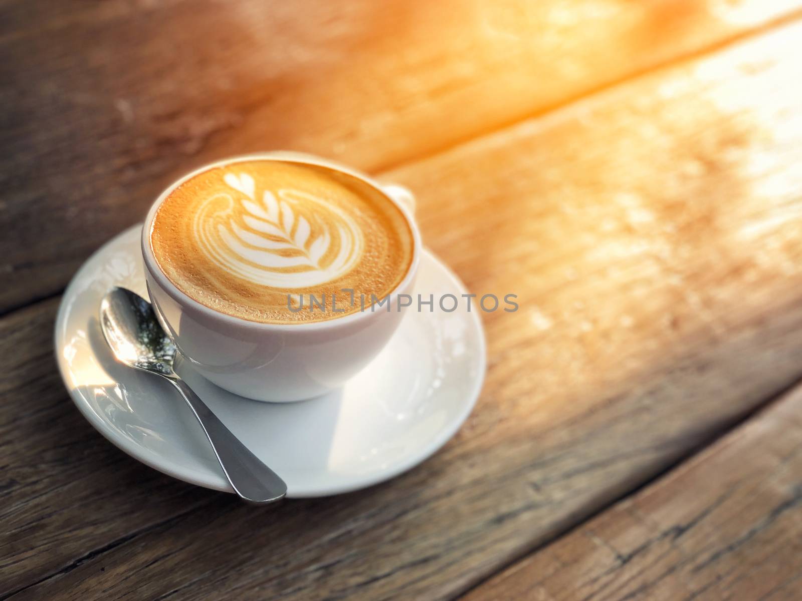 Coffee cup latte art in morning by Surasak