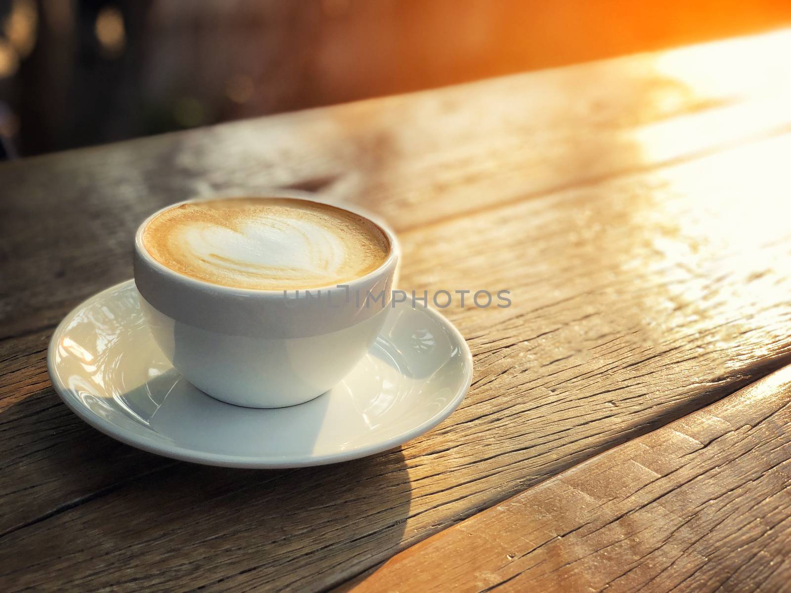 Coffee cup latte art in morning by Surasak