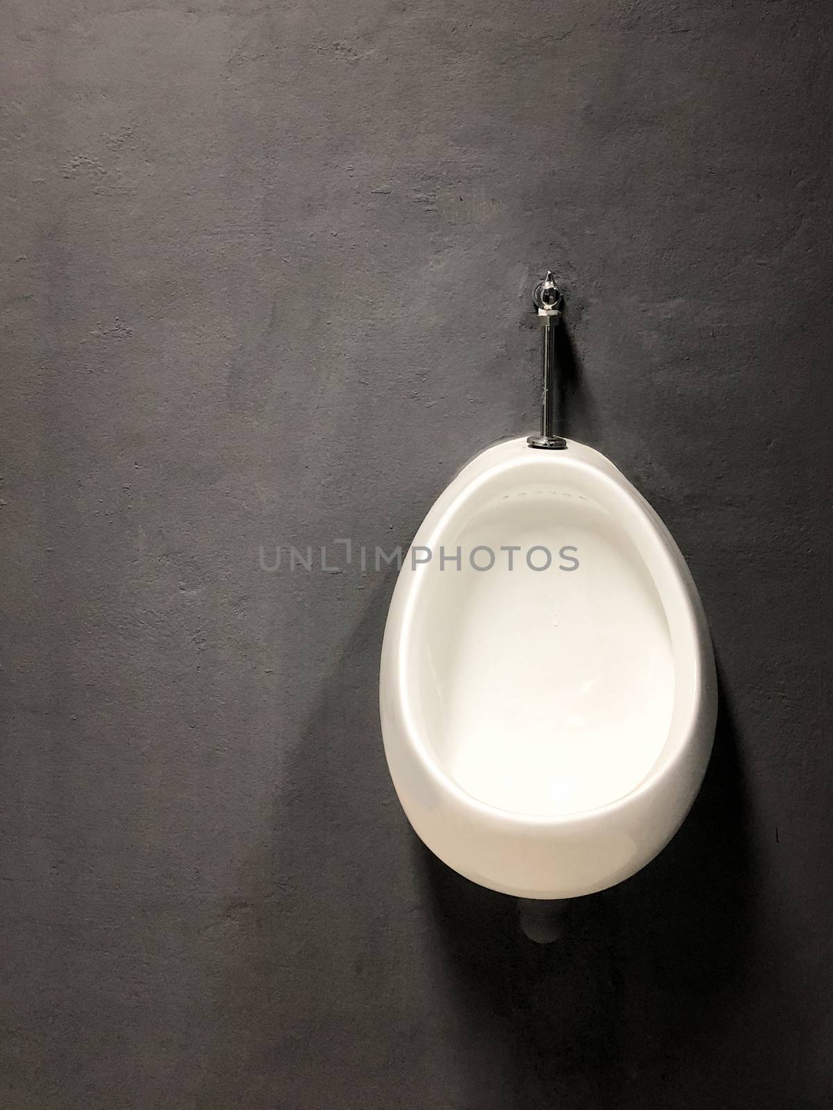 Urinal hang on loft wall style background by Surasak