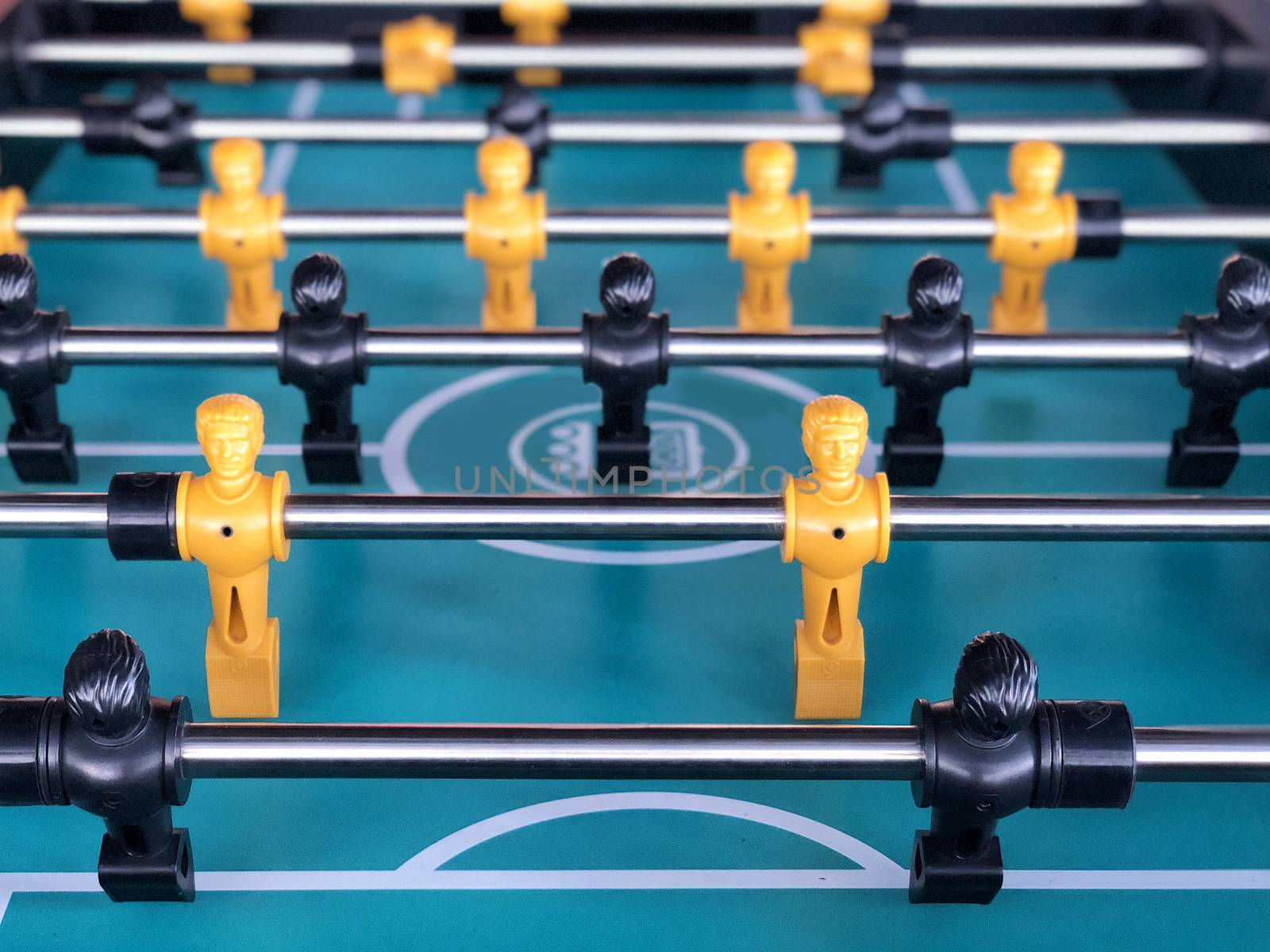 Table football game, Soccer table with yellow and black players by Surasak