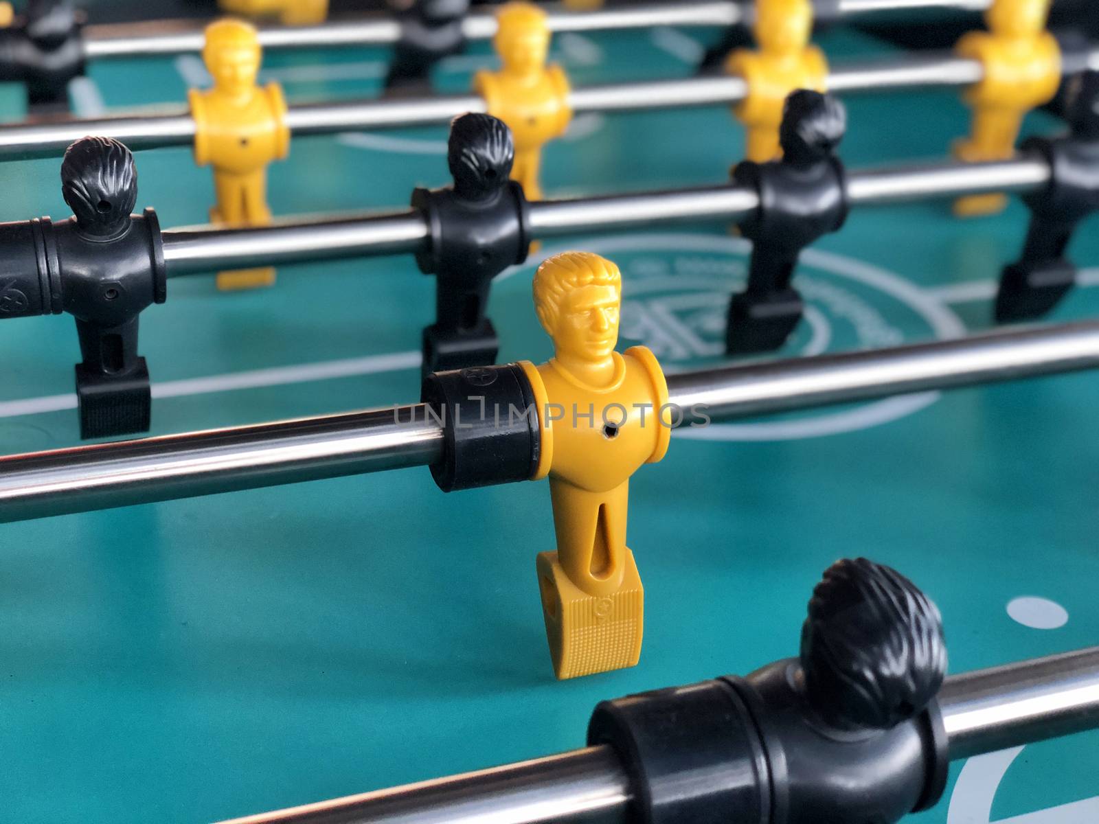 Table football game, Soccer table with yellow and black players by Surasak