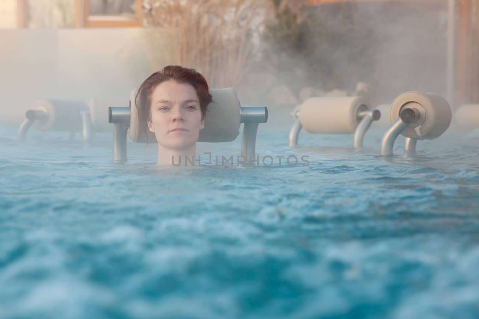 whirlpool with a young attractive relaxing woman.
