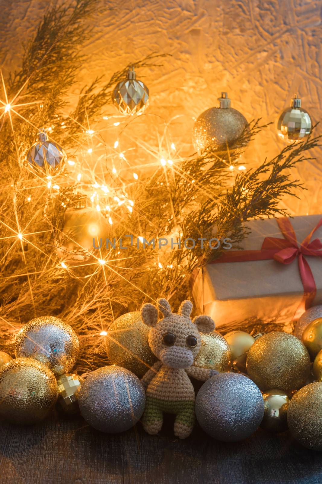New year's holiday composition with gift box, toy bull, and garland decor by galinasharapova