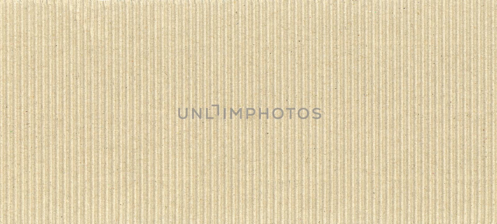light brown corrugated cardboard texture background by claudiodivizia