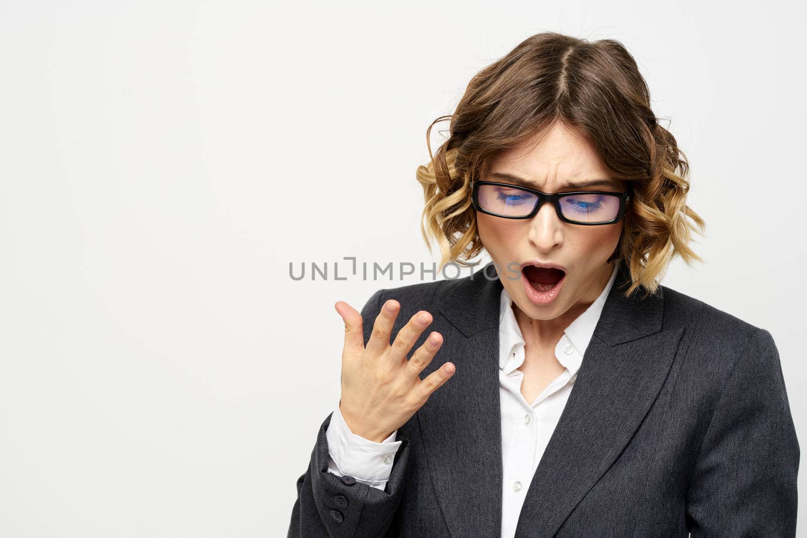 Business woman with notepad and glasses work light background cropped view of suit model. High quality photo