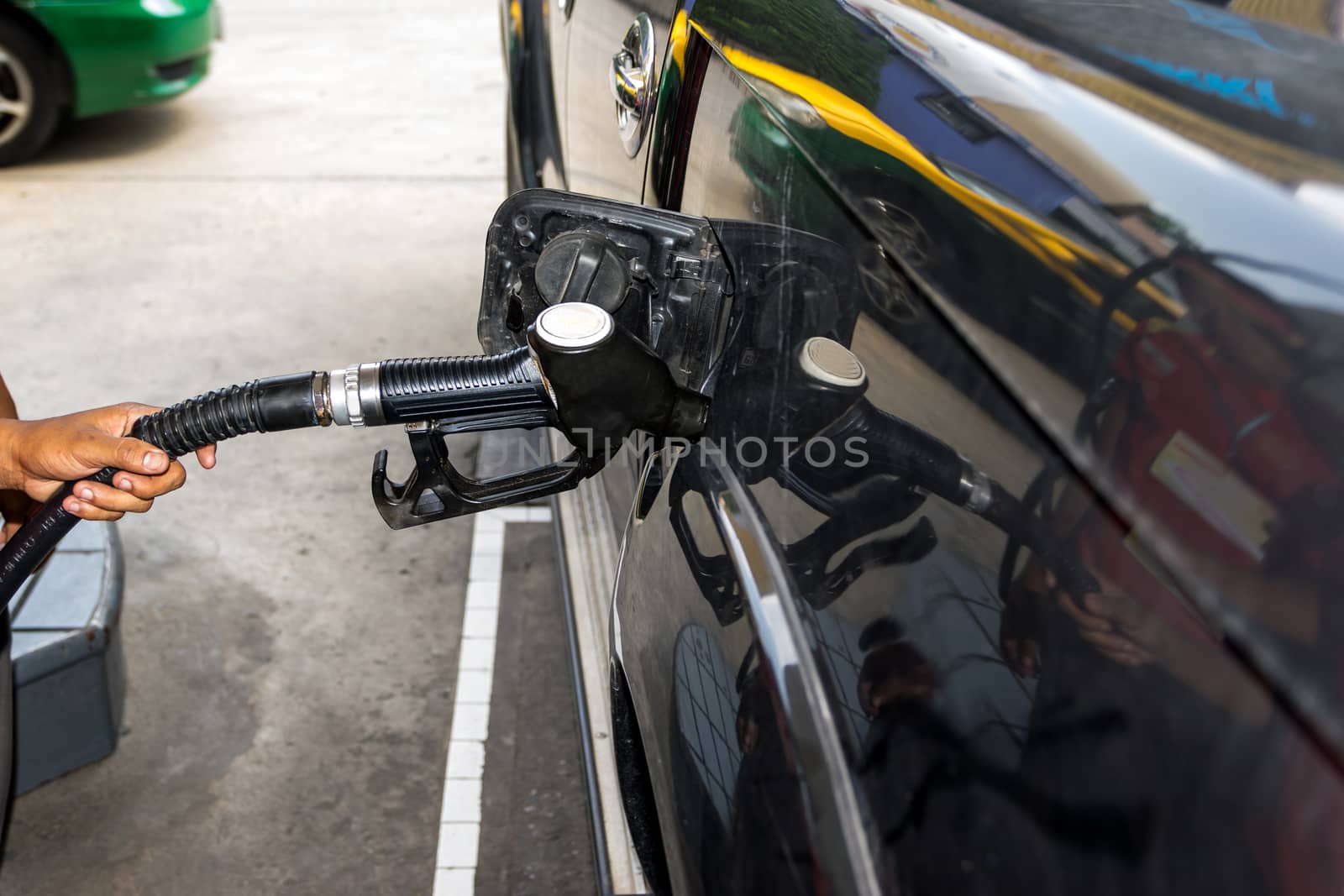 Fuel nozzle pay for fuel and benzyl. by wattanaphob