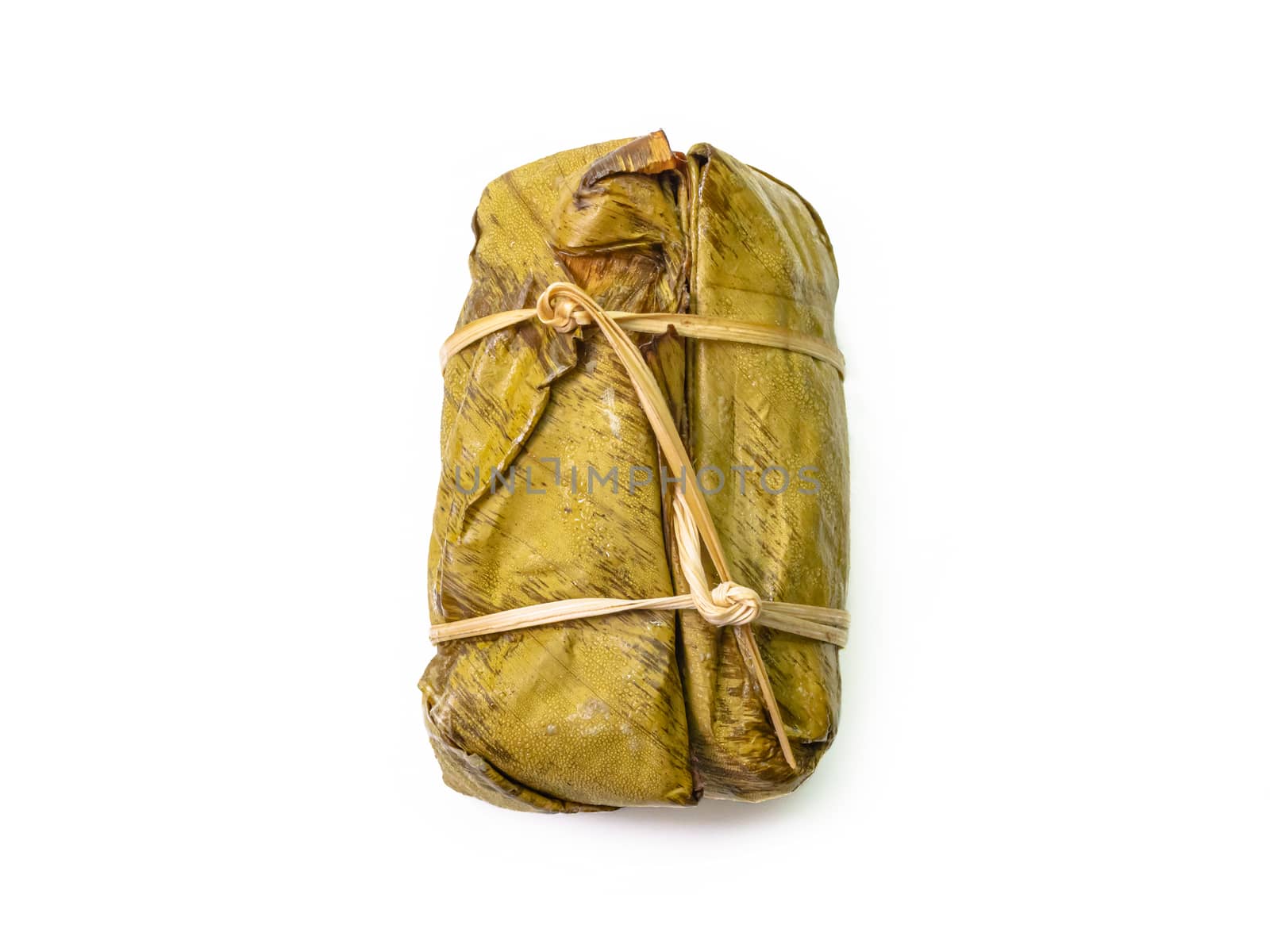 Thai steamed sticky rice with coconut milk and banana (Khao Tom Mud) wrapped by banana leaf on white background. by phasuthorn