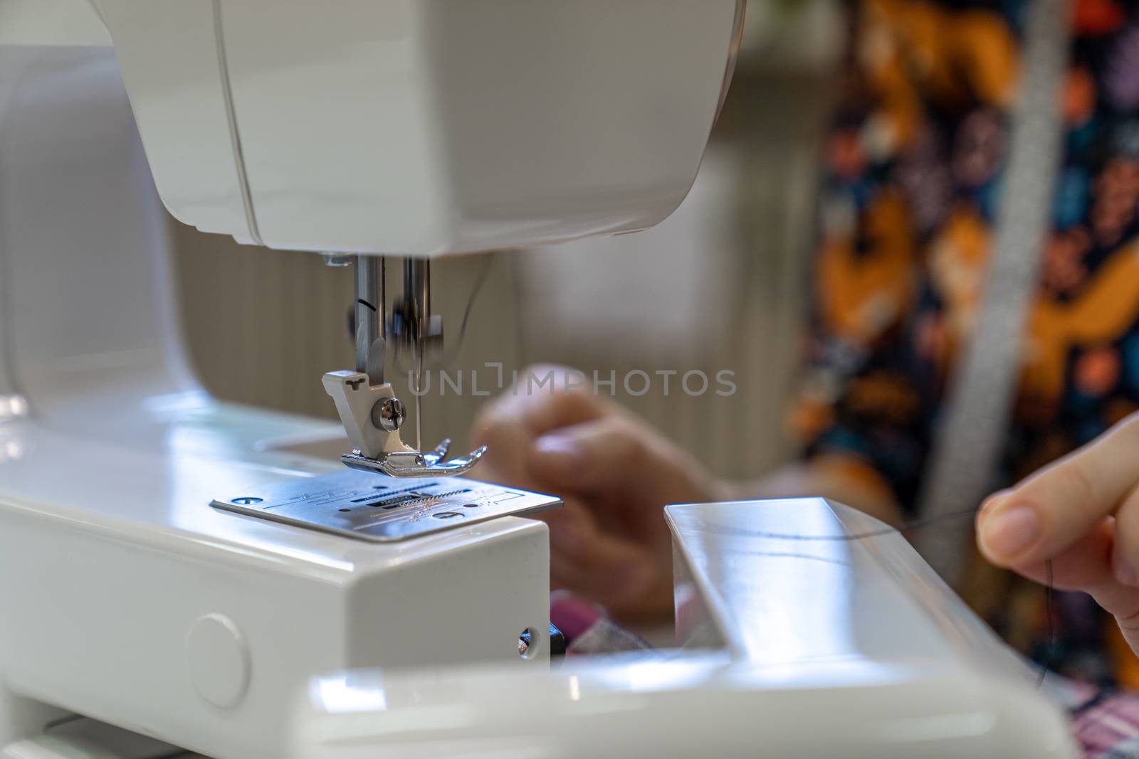 thread replacement in a sewing machine for stapling fabric.