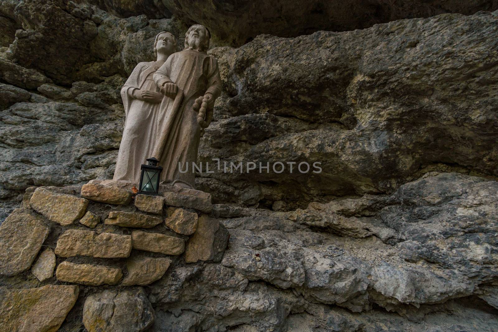 Holy stone statue in the Brother Klaus Grotto a pilgrimage site at Beuron Monastery in the Danube Valley in autumn